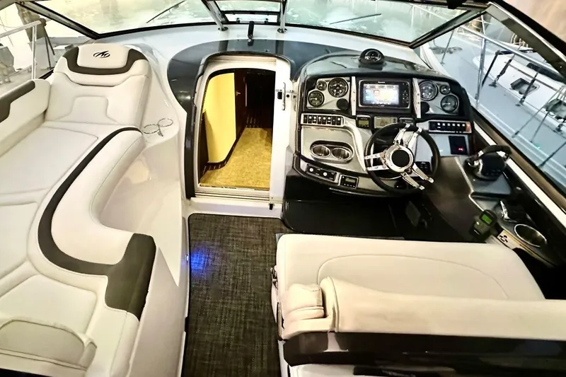 Slide: The Image of Interior of 2013 Monterey 400 Sport Yacht, featuring luxurious seating and advanced control panel. - 3
