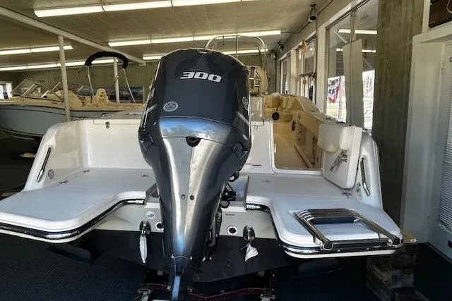 Slide: The Image of 2019 Grady-White Fisherman 236 boat with powerful 300 HP outboard engine in showroom. - 13