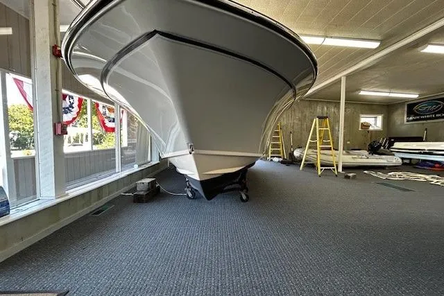 Slide: The Image of 2019 Grady-White Fisherman 236 boat displayed indoors on carpeted floor. - 3