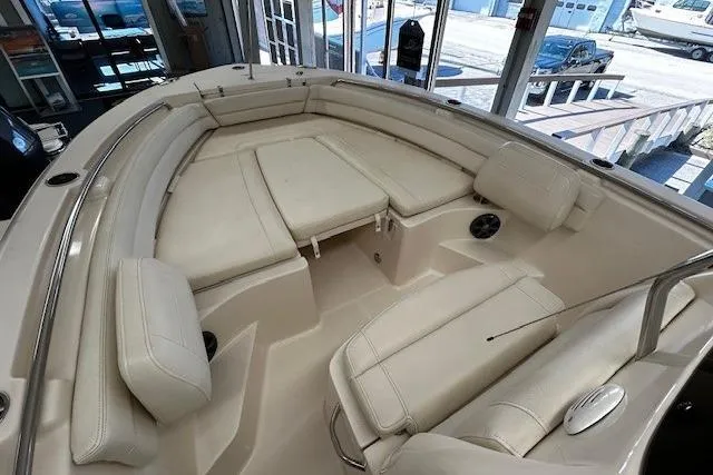 Slide: The Image of 2019 Grady-White Fisherman 236 boat interior with cushioned seating and spacious layout. - 5