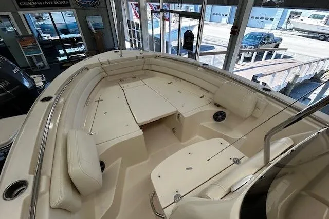 Slide: The Image of 2019 Grady-White Fisherman 236 boat interior with cushioned seating and storage compartments. - 6