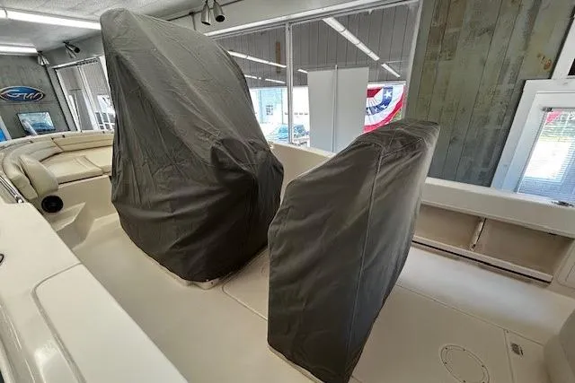 Slide: The Image of 2019 Grady-White Fisherman 236 boat interior with covered seats in showroom. - 7