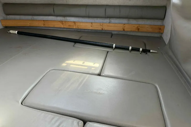 Slide: The Image of Interior cabin of 2000 Glacier Bay 2670 Island Runner with cushioned seating and a stored pole. - 11