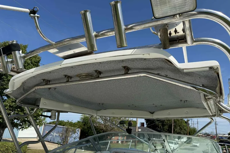 Slide: The Image of T-top of 2000 Glacier Bay 2670 Island Runner boat with rod holders and lights. - 15