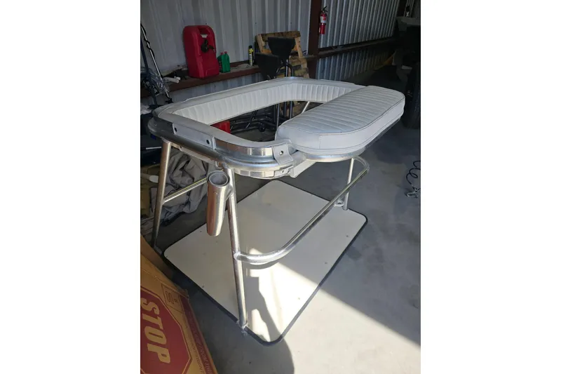 Slide: The Image of Fishing chair from a 2000 Glacier Bay 2670 Island Runner, in a storage area. - 17