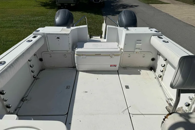 Slide: The Image of 2000 Glacier Bay 2670 Island Runner boat interior with storage and seating. - 2