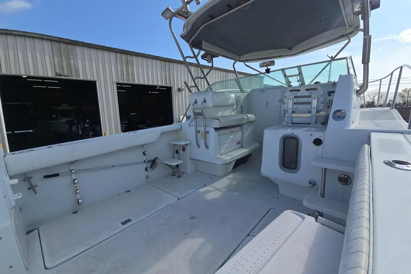 Slide: The Image of 2000 Glacier Bay 2670 Isle Runner boat interior with seating and storage compartments. - 28