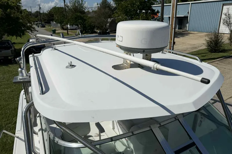 Slide: The Image of 2000 Glacier Bay 2670 Island Runner boat with radar and antenna on the roof. - 3