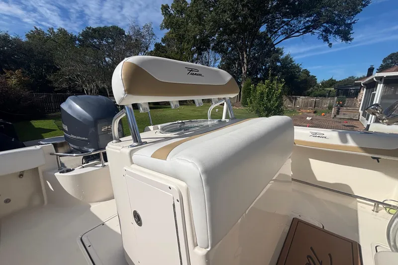 Slide: The Image of 2015 Pioneer 222 Sportfish boat interior with Yamaha engine, outdoor setting. - 13