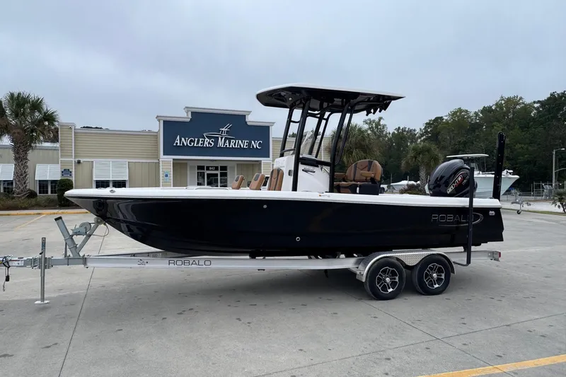 The Image of 2024 Robalo 226 Cayman boat on trailer at Anglers Marine NC dealership. - 0