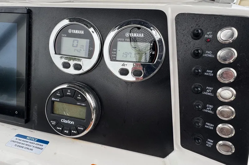 Slide: The Image of Dashboard of 2024 Robalo 226 Cayman with Yamaha gauges and Clarion audio system. - 16