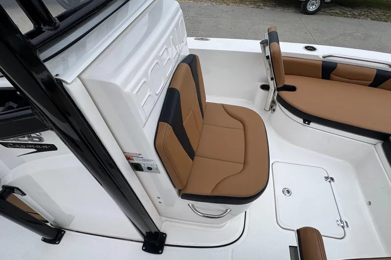 Slide: The Image of 2024 Robalo 226 Cayman boat interior with tan and black seating. - 9