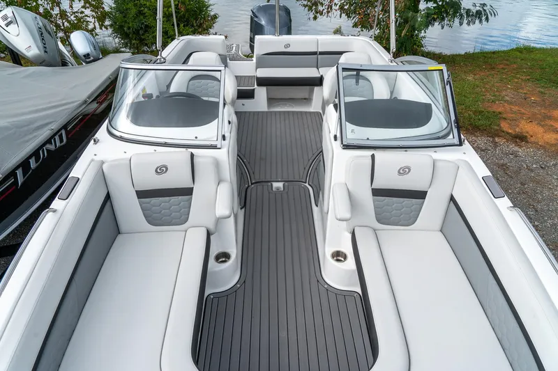 Slide: The Image of 2024 Hurricane SunDeck 217 OB boat interior with sleek seating and modern design. - 16
