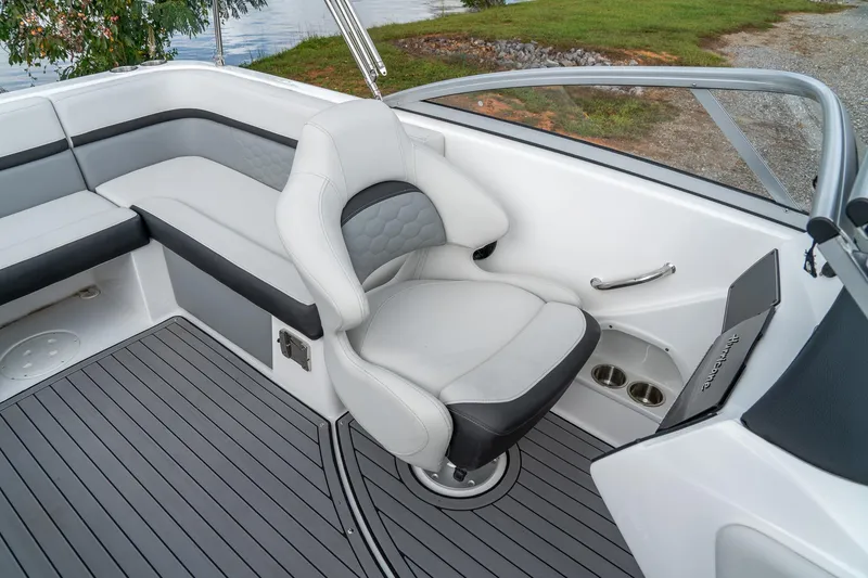 Slide: The Image of 2024 Hurricane SunDeck 217 OB boat interior with gray seating and sleek design. - 19