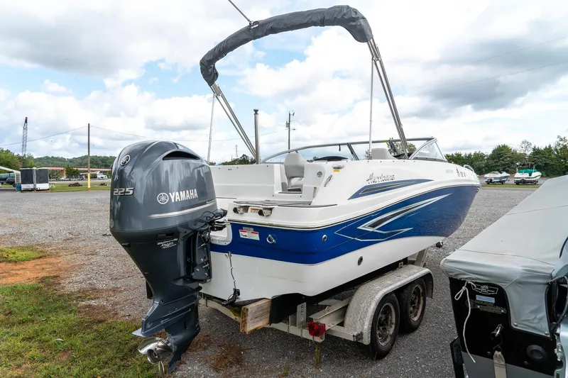 Slide: The Image of 2024 Hurricane SunDeck 217 OB boat with Yamaha 225 engine on trailer. - 7