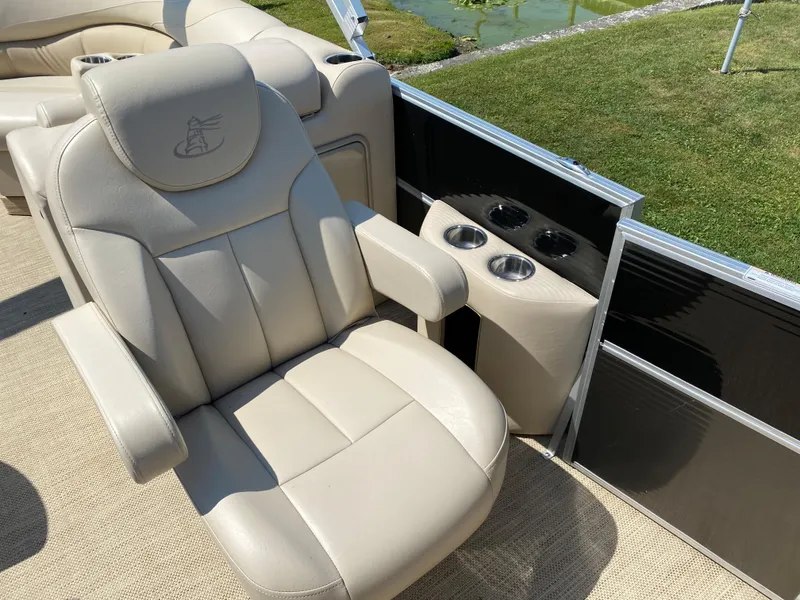Slide: The Image of Luxurious seating on 2015 Misty Harbor 2685SU Tri Toon boat with cup holders. - 14