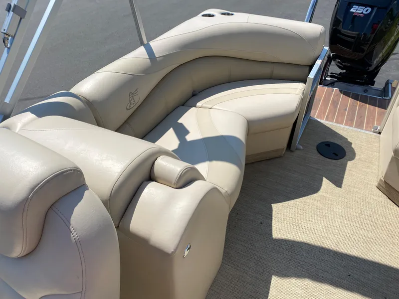 Slide: The Image of Luxurious seating on 2015 Misty Harbor 2685SU Tri Toon boat, featuring beige upholstery. - 15