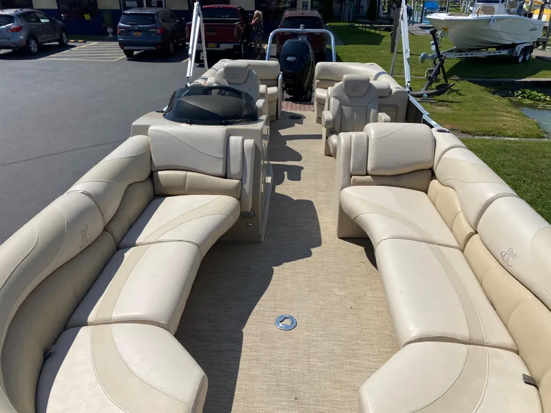 Slide: The Image of 2015 Misty Harbor 2685SU Tri Toon boat with spacious beige seating and modern design. - 17