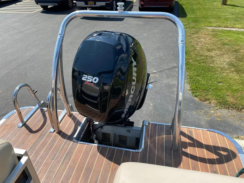 Slide: The Image of 2015 Misty Harbor 2685SU Tri Toon with Mercury 250 engine on wooden deck. - 19