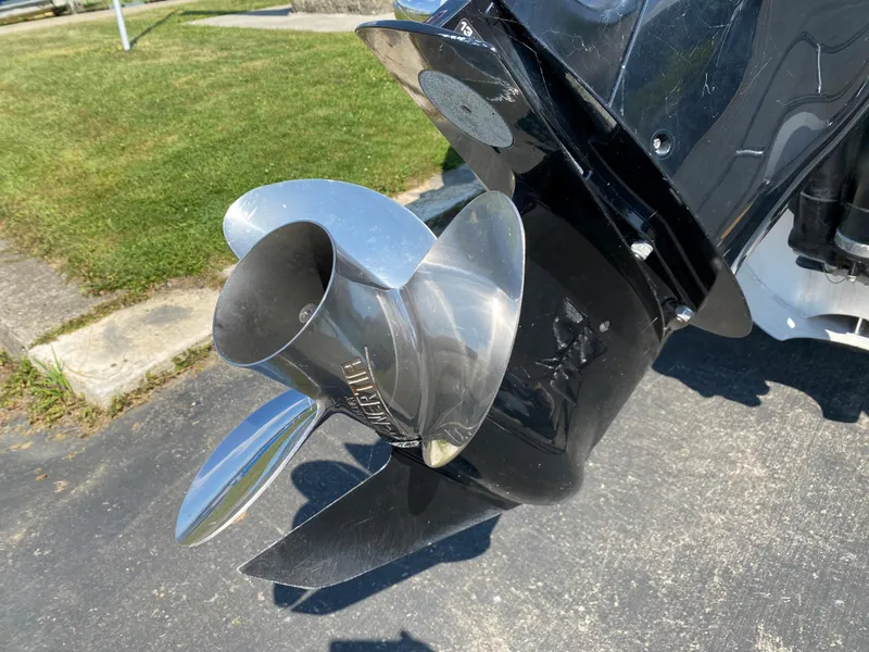 Slide: The Image of Propeller of 2015 Misty Harbor 2685SU Tri Toon boat on pavement. - 23