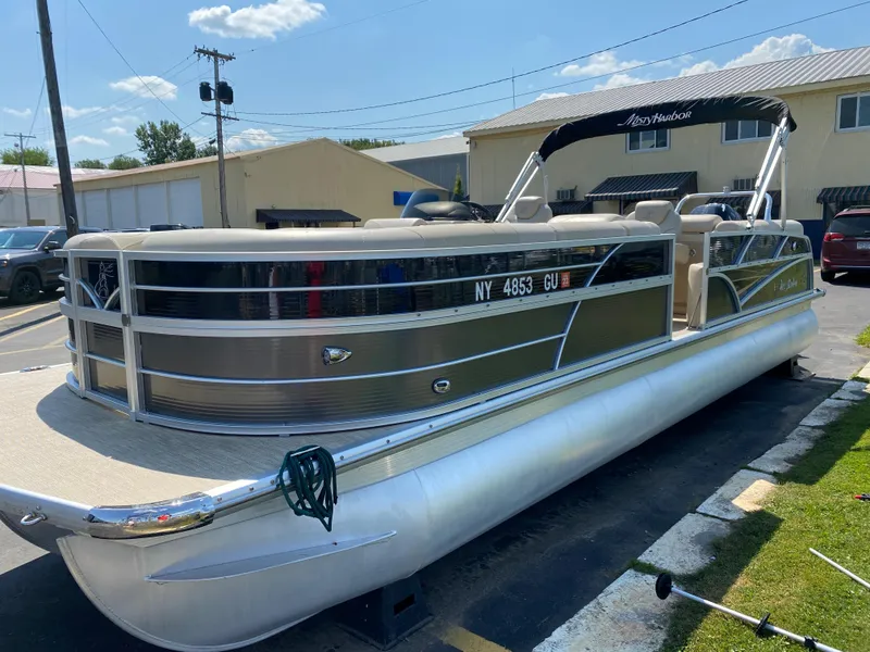 Slide: The Image of 2015 Misty Harbor 2685SU Tri Toon pontoon boat parked outdoors on a sunny day. - 24