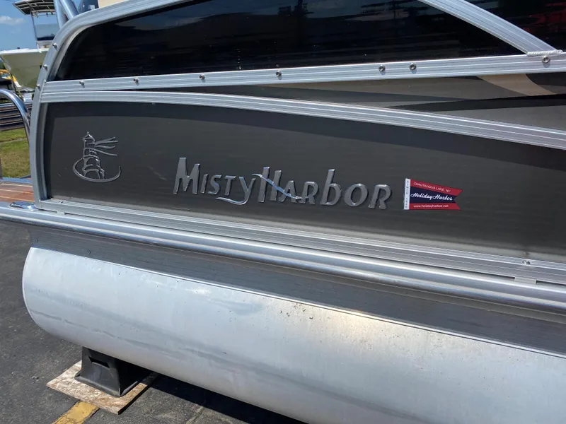 Slide: The Image of 2015 Misty Harbor 2685SU Tri Toon boat, side view with logo and branding. - 4
