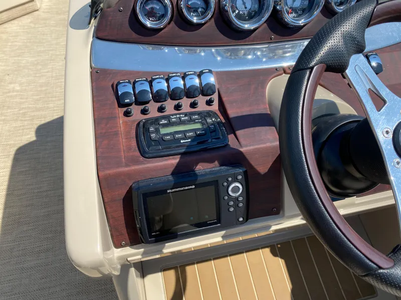 Slide: The Image of Control panel of 2015 Misty Harbor 2685SU Tri Toon boat with gauges and electronics. - 8