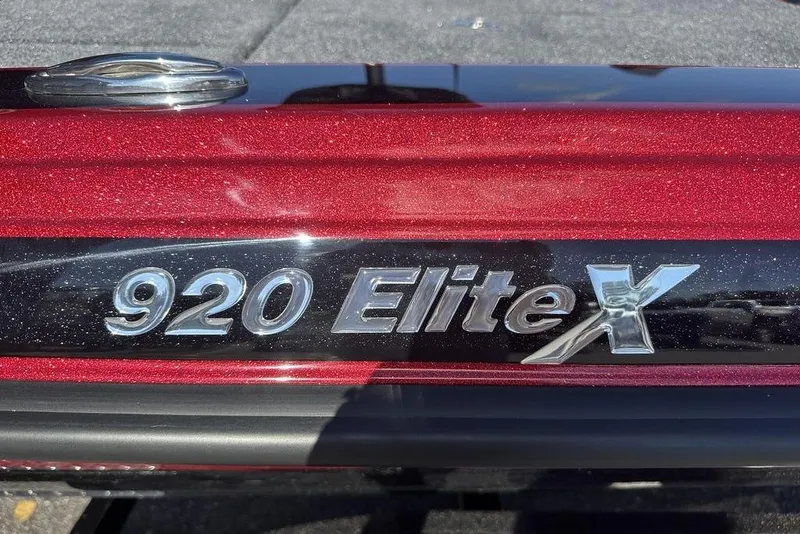 Slide: The Image of Close-up of 2026 Phoenix 920 Elite X model emblem on a red metallic surface. - 4