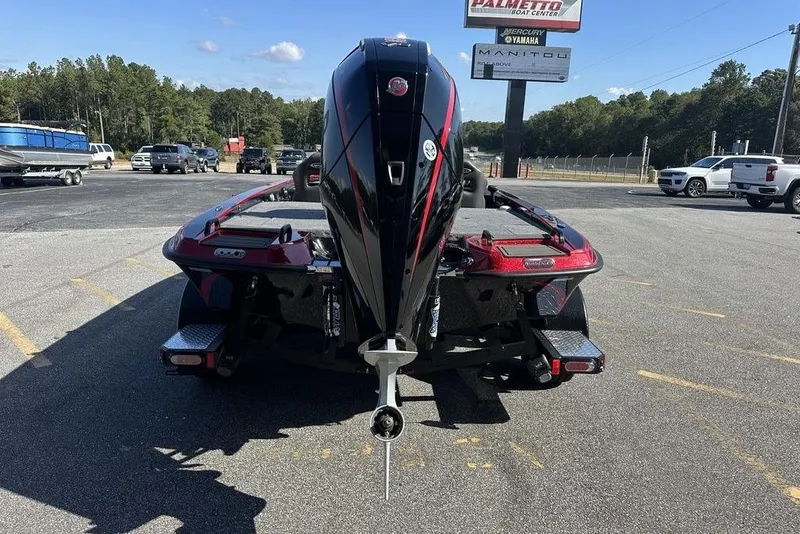 Slide: The Image of 2026 Phoenix 920 Elite boat with powerful outboard motor in parking lot. - 5