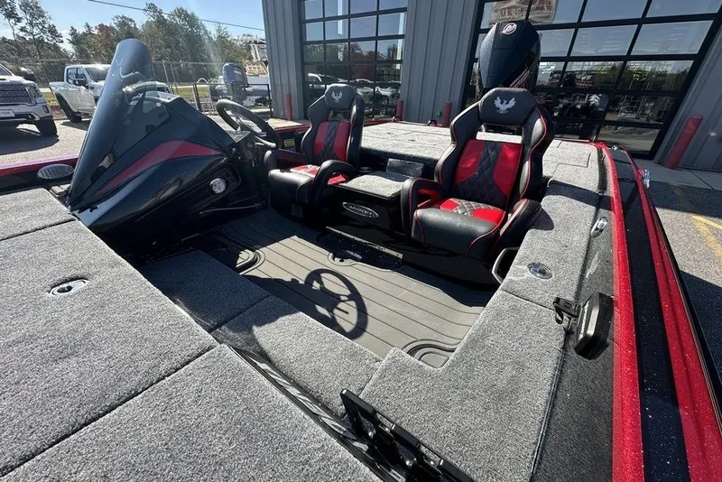 Slide: The Image of 2026 Phoenix 920 Elite boat interior with red and black seats, steering wheel, and dashboard. - 8