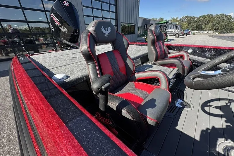 Slide: The Image of 2026 Phoenix 920 Elite boat interior with red and black seats, steering wheel, and motor. - 9