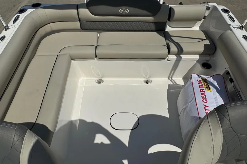 Slide: The Image of 2025 Key West 203 DFS boat interior with cushioned seating and safety gear bag. - 18