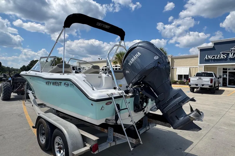 Slide: The Image of 2025 Key West 203 DFS boat with Yamaha engine on trailer at dealership. - 3