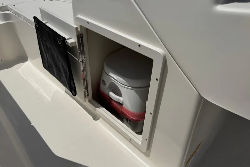 Slide: The Image of 2025 Key West 203 DFS boat with built-in storage compartment and portable toilet. - 9