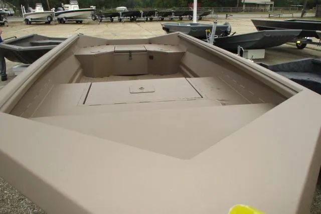Slide: The Image of 2026 Reaper Boats 550-1691 model, beige interior, displayed outdoors. - 5