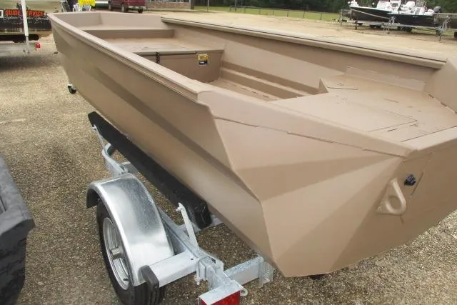 Slide: The Image of 2026 Reaper Boats 550-1691 model on trailer, beige color, parked outdoors. - 6
