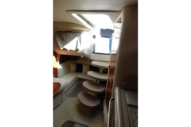 Slide: The Image of Interior of 2007 Sea Ray 320 Sundancer yacht with cozy seating and elegant staircase. - 15
