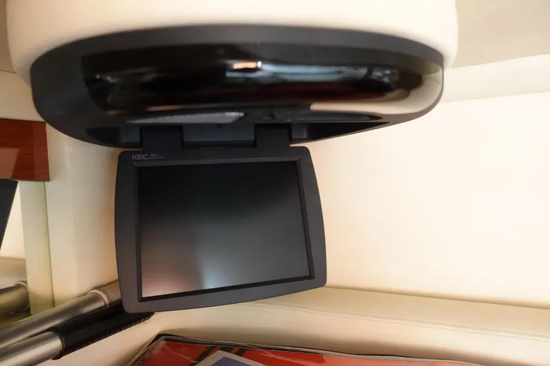 Slide: The Image of Flip-down monitor inside 2007 Sea Ray 320 Sundancer boat cabin. - 26