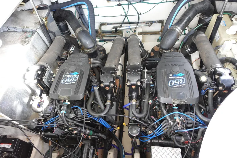 Slide: The Image of Engine compartment of a 2007 Sea Ray 320 Sundancer with twin Mercury 350 MAG MPI engines. - 27