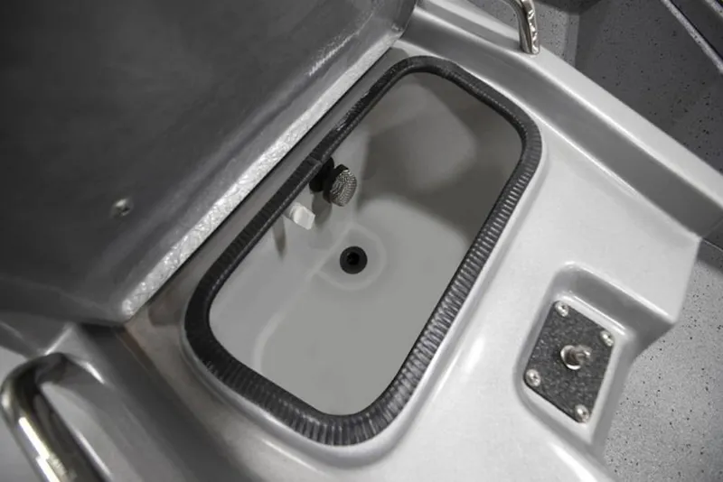 Slide: The Image of 2026 Xpress H20B Bay boat interior with rod holders and camo design. - 6