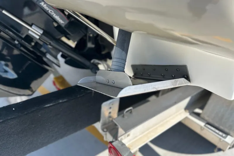 Slide: The Image of Close-up of 2007 Sea Ray 290 SLX boat's trim tab and outdrive on a trailer. - 11