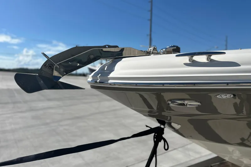 Slide: The Image of 2007 Sea Ray 290 SLX boat anchor detail under clear blue sky. - 16