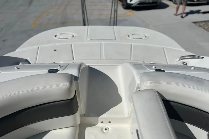 Slide: The Image of 2007 Sea Ray 290 SLX boat interior with white seating and deck view. - 24