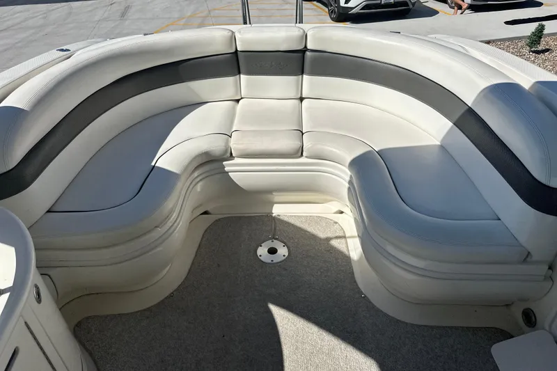 Slide: The Image of 2007 Sea Ray 290 SLX boat on trailer under clear blue sky. - 27