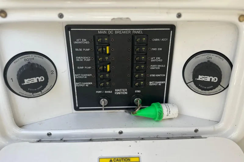 Slide: The Image of 2007 Sea Ray 290 SLX main DC breaker panel with Guest battery switches. - 32