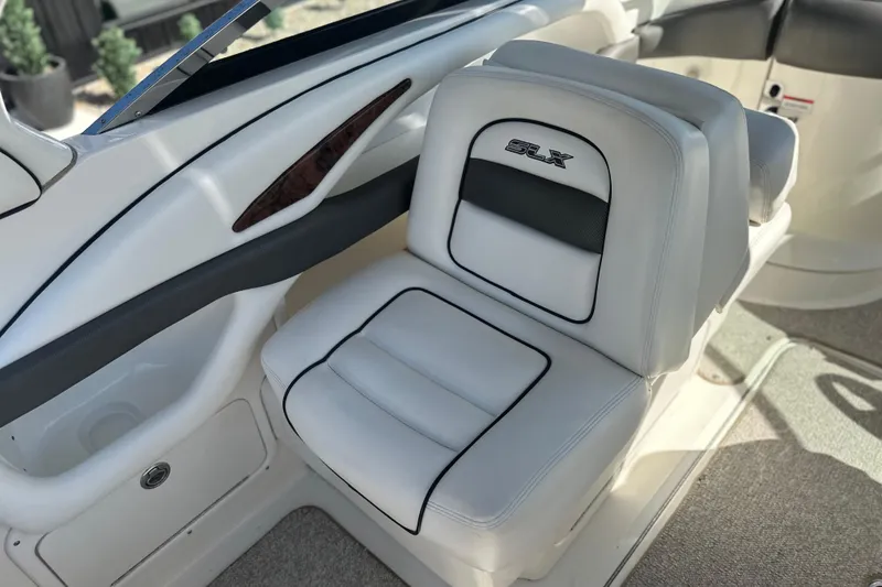 Slide: The Image of 2007 Sea Ray 290 SLX boat interior with white leather seating and sleek design. - 38