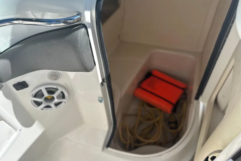 Slide: The Image of 2007 Sea Ray 290 SLX boat interior with life jacket and rope storage. - 44