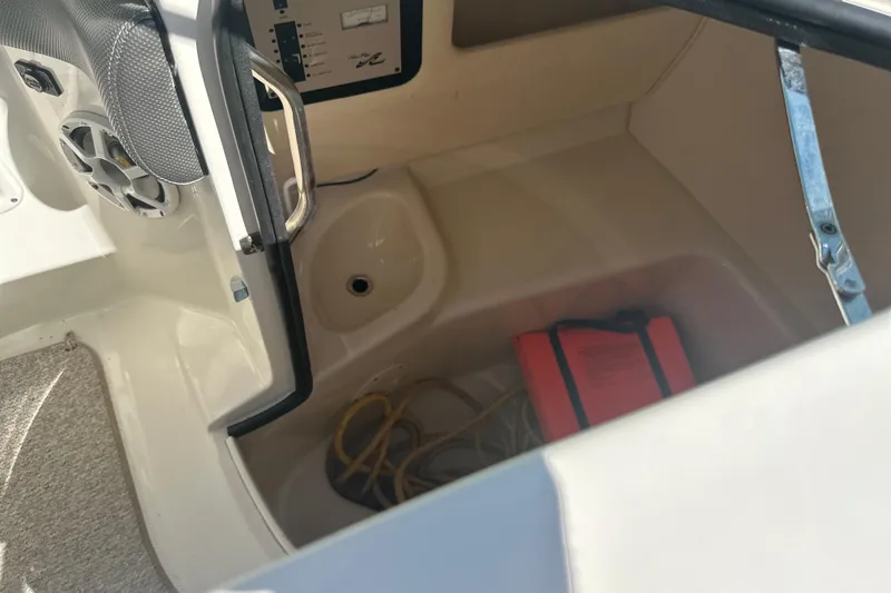 Slide: The Image of Interior storage compartment of a 2007 Sea Ray 290 SLX boat with speaker and wiring. - 45