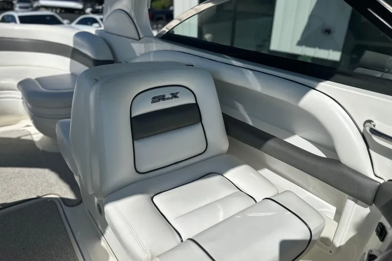 Slide: The Image of 2007 Sea Ray 290 SLX boat interior with white leather seating and SLX logo. - 48