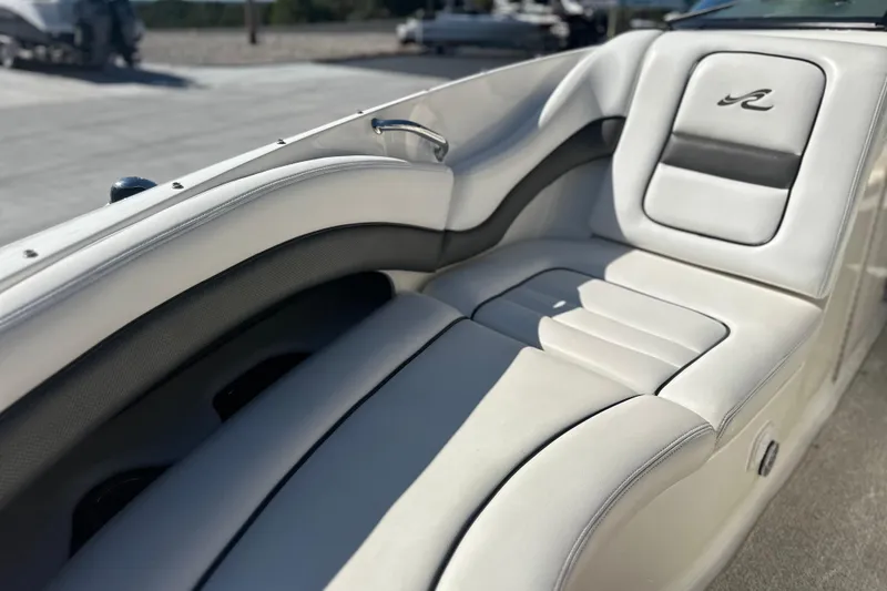Slide: The Image of Luxurious seating on a 2007 Sea Ray 290 SLX boat, featuring elegant white upholstery. - 62
